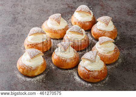 Sweet Buns Semla Or Semlor With Cardamom, Filled With Almond Paste And Whipped Cream Closeup On The 