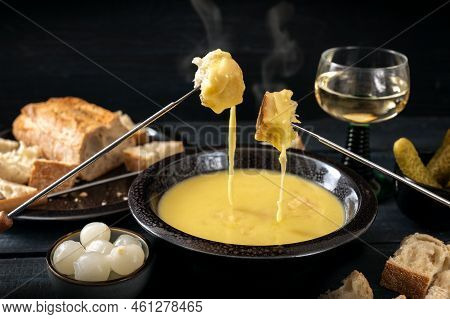 Swiss Cheese Fondue With Bread, Pickles And Wine, The Festive Dinner Is Often Served At New Year, Da