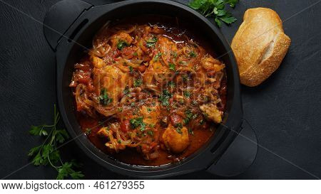 Chakhokhbili - Traditional Georgian Dish. Chicken Stewed With Fresh Coriander Tomatoes And Herbs