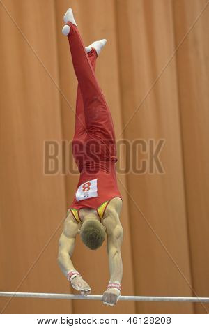 KIEV, UKRAINE - MARCH 31: Tomas Kuzmickas, Lituania performs exercise on high bar during International Tournament in Artistic Gymnastics Stella Zakharova Cup in Kiev, Ukraine on March 31, 2013