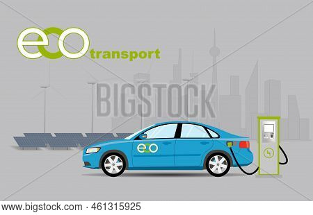 Charging A Blue Passenger Car At An Electric Charging Station Against The Backdrop Of A Solar Power 