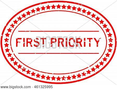 Grunge Red First Priority Word Oval Rubber Seal Stamp On White Background