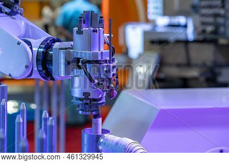 Close Up Automation System Robot Arm With Gripper During Bring Process Metal Ring Or Workpiece To De