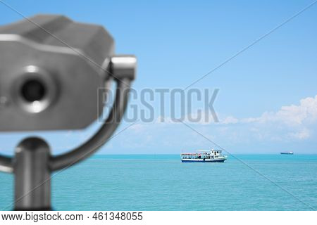 Metal Tower Viewer And Picturesque View Of Sea With Boat. Mounted Binoculars