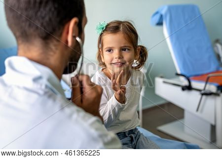 Healthcare Medical Exam People Child Concept. Close Up Of Happy Girl And Doctor With Stethoscope