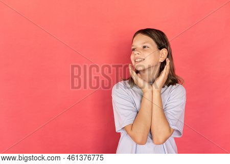 Portrait Of Happy Girl Looking At Something With Admiration. Preteen Caucasian Child Wearing Blue T-