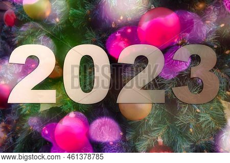 Blurry Bokey Christmas Lights During Holiday Season And 2023 Sign