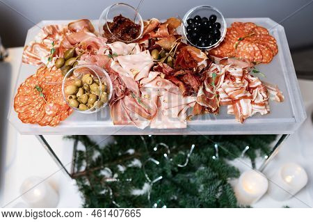 Plate With Meat, Salami, Ham, Backon, Prosciutto On Dark Grey Black Slate Background