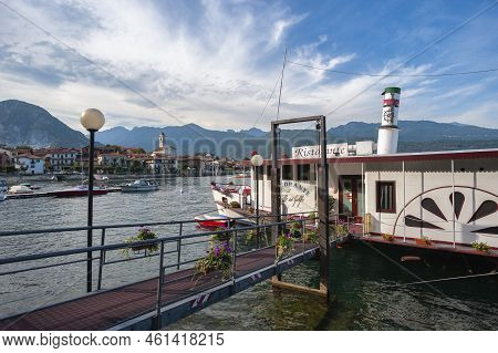 Feriolo, Italy - August 17, 2018: Townscape Of Feriolo With Ship Restaurant On The Lake Promenade. F