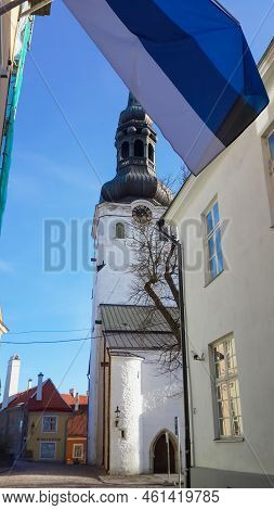 Tallinn, Estonia - 05.24.2019: National Flag Of Estonia And Medieval Toomkirik - Dome Church St. Mar