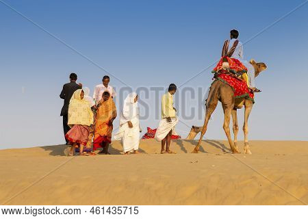 Thar Desert, Rajasthan, India - October 15th 2019 : Tourists Riding Camels, Camelus Dromedarius, At 