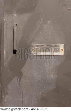Closeup Of Entrance Door Rusty Steel Iron With Silver Old Shiny Mail Slot As Mailings Concept
