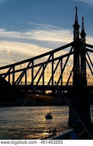 The Historic Freedom Bridge Over The Danube River, Szabadsag Hid, In Budapest At Sunset