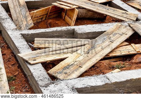 Dismantling The Strip Foundation Formwork At The Construction Site. Dismantling Of Wooden Formwork P