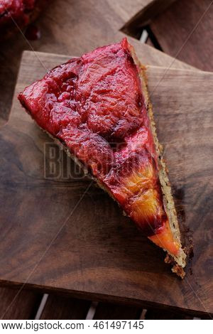 Plum Pie. Rustic Plum Cake On A Dark Wooden Background. High Quality Photo
