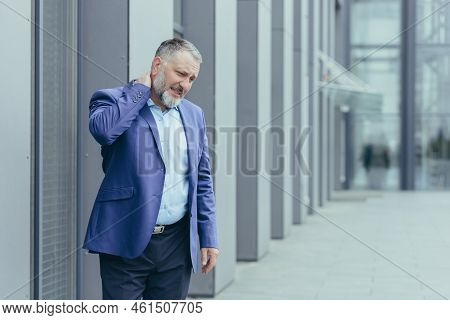 An Senior Man, A Banker, An Office Worker In Suit, Went Outside The Office For A Lunch Break, His Ne