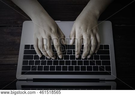 Businessman Hand Using A Laptop Computer Typing Into Write Content, Social Media Maketing Concept.