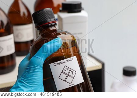 Caustic Soda In Bottle, Chemical In The Laboratory And Industry