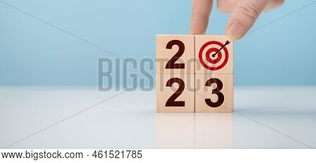 2023 Time For New Start. Goal Sign And 2023 Wooden Cubes On Table, Blue Background. Concept For Visi