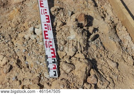 Telescopic Leveling Lath Is Helping Surveyor, Geodesist To Measure Position, Depth At Building Site