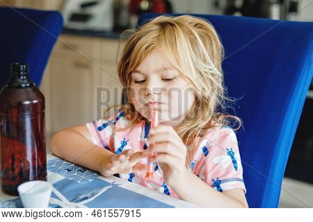 Sick Little Child With Temperature And Fever Medicine. Preschool Girl Taking Juice Against High Temp
