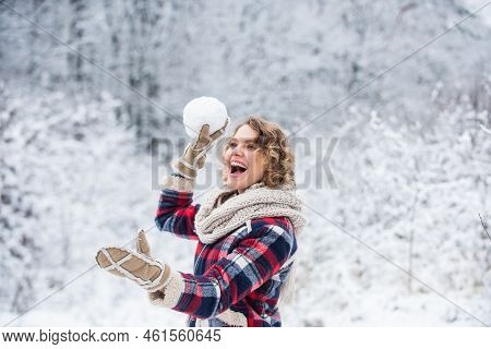 Snowball Fight. Winter Holiday Activity. Cheerful Woman Enjoy Xmas Vacation. Woman Warm Clothes In S