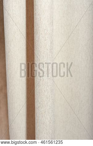 Vertical Shot Of Beige Blackout Curtains Made Of Textured Canvas, Unbleached Natural Fabric. Good Ni