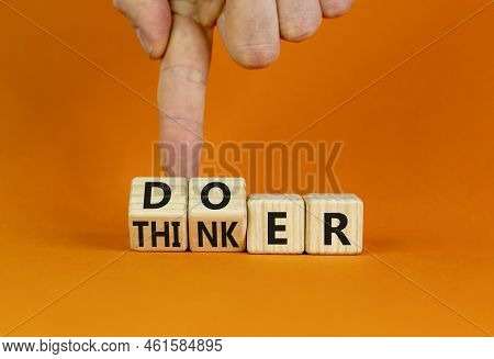 Doer Or Thinker Symbol. Concept Words Doer Or Thinker On Wooden Cubes. Businessman Hand. Beautiful O
