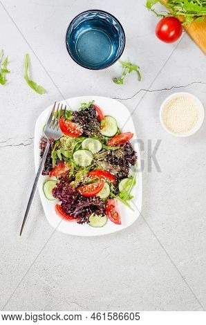 Healthy Vegetable Salad With Fresh Salad Leaves, Arugula, Cherry Tomato, Cucomber And Parsley In Pla