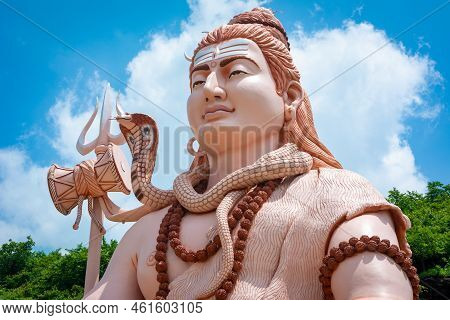 Hindu God Shiva Sculpture Sitting In Meditation. Yoga And Meditation Concept.