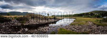 A Secluded Creek That Splits Off The Ocean In Ullapool, Scotland, A Short Stroll From The Township.