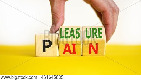 Pain Or Pleasure Symbol. Concept Words Pain Or Pleasure On Wooden Cubes. Businessman Hand. Beautiful
