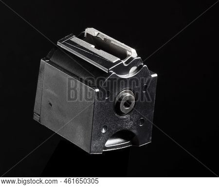 Rotary Magazine For A Semi-automatic Rimfire Rifle On A Black Background