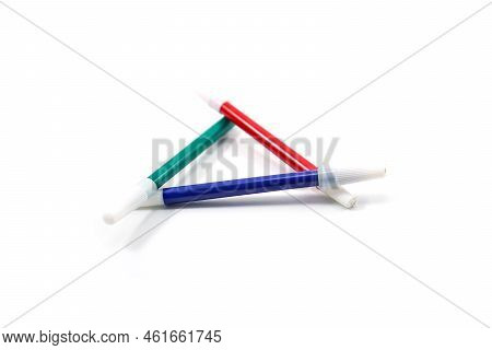 Conceptual Green, Red, And Blue Triangular Markers Isolated On White