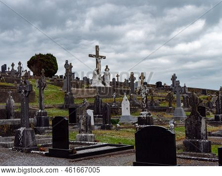 West Cork, Ireland, May 2, 2022. An Catholic Cemetery On A Cloudy Spring Day. Stone Tombstones. Ceme