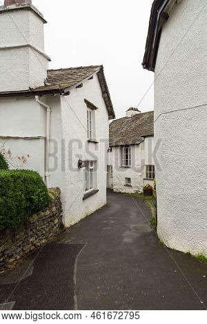 Facade Of A White Buildings In The Village Of Hawkshead In The South Lakeland, England, Uk