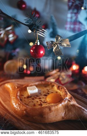 Traditional Georgian Adjarian Khachapuri With Suluguni Cheese, Egg Yolk, Butter