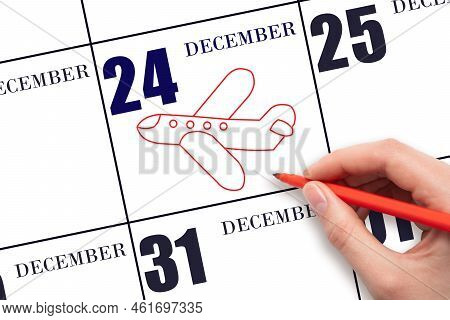 24th Day Of December. A Hand Drawing Outline Of Airplane On Calendar Date 24 December. The Date Of F