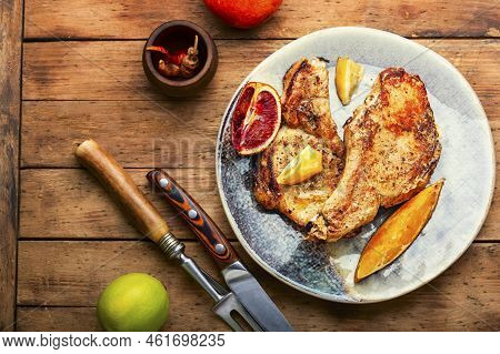 Barbecue Meat Steak With Citrus Fruits.