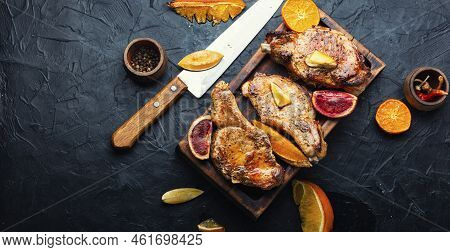 Steak On The Bone Grilled With Citrus Fruits.