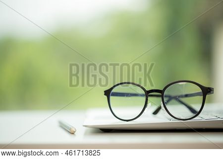 Object Education Green Nature Background With Stack Of Ancient Books Or Old Bible, Open Paper Book O