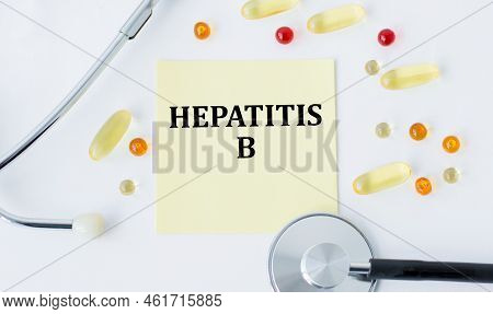 A Card With Text Hepatitis B On A Table With A Pills