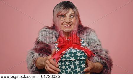 Positive Smiling Stylish Woman Presenting Birthday Gift Box Stretches Out Hands, Offer Wrapped Prese