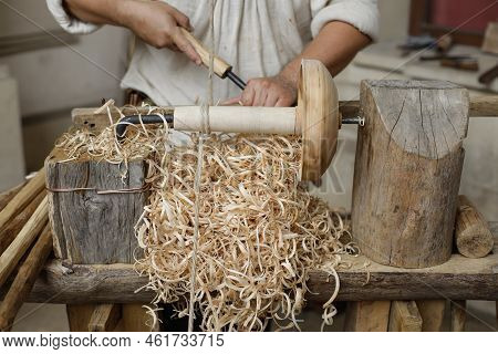 Shallow Depth Of Field (selective Focus) Details With A Craftsman Using An Ancient Roman Woodturning
