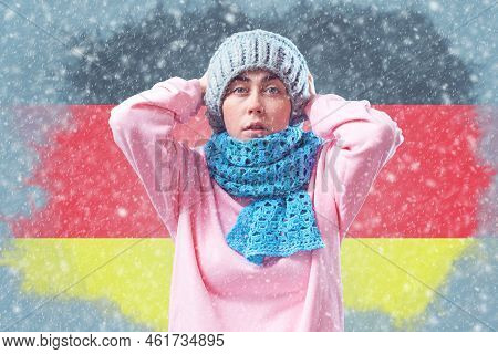 Energy Crisis In Europe.shocked German Woman In A Hat And Scarf Is Breathing And Coughing.in The Bac