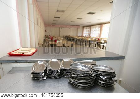 Iron Plates In The Background Of A Public Dining Room.school Breakfast In A Russian School