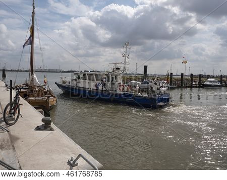 Doel, Belgium, 21 August 2022, Police Boat Sails Out Of The Small Harbor Of The Polder Village Of Do