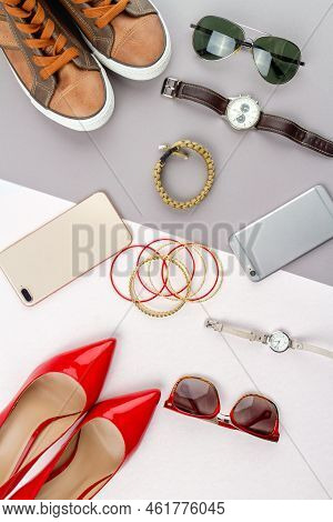 Flat Lay Composition Of Womens And Mens Accessories. Vertical Shot Top View Contrast Of Male And Fem