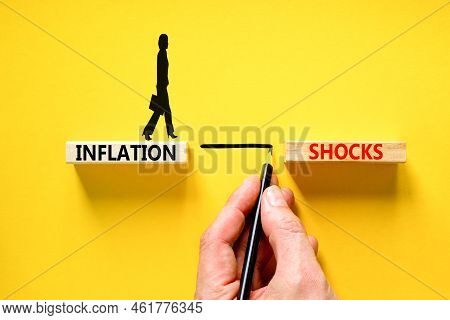 Inflation Shocks Symbol. Concept Words Inflation Shocks On Wooden Blocks. Beautiful Yellow Table Yel