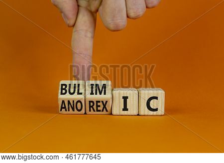 Bulimic Or Anorexic Symbol. Doctor Turns Wooden Cubes And Changes The Word Anorexic To Bulimic. Beau